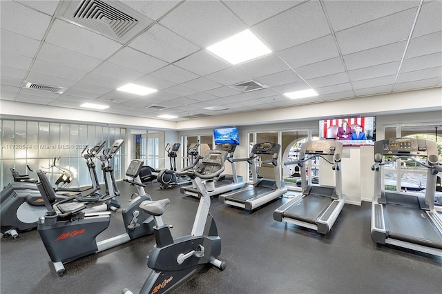 exercise room featuring a drop ceiling