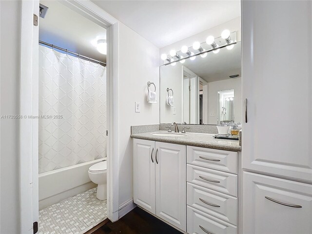 full bathroom featuring tile patterned floors, vanity, toilet, and shower / bath combo