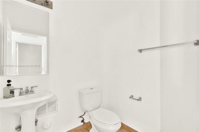 bathroom with toilet and sink