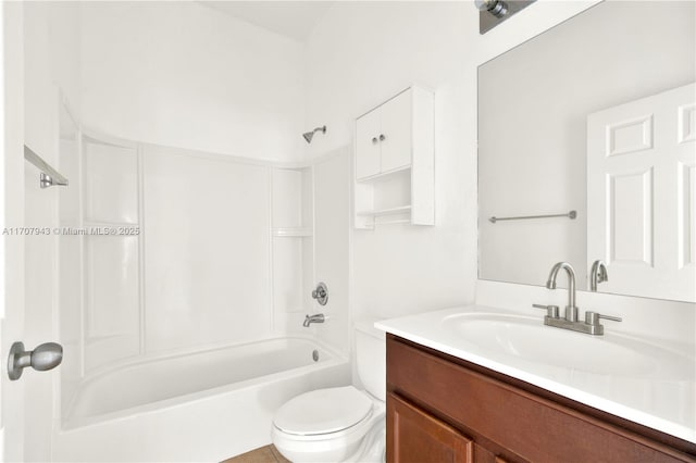 full bathroom featuring shower / tub combination, vanity, and toilet