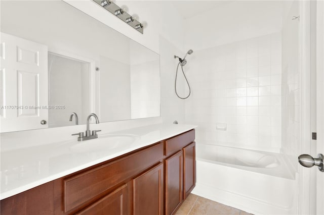 bathroom featuring tile patterned flooring, shower / bathing tub combination, and vanity