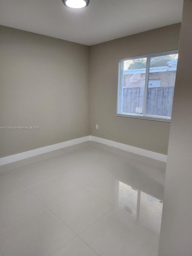 view of tiled spare room