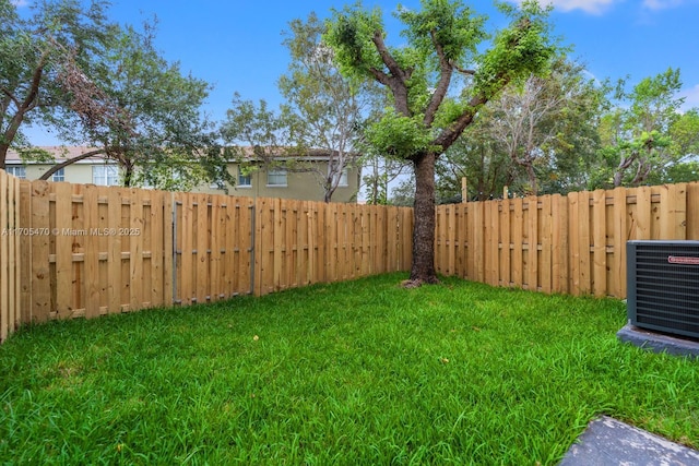 view of yard with central AC unit