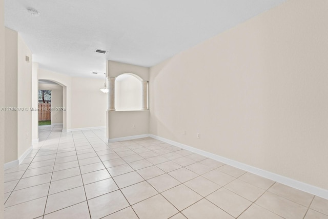 unfurnished room with light tile patterned floors