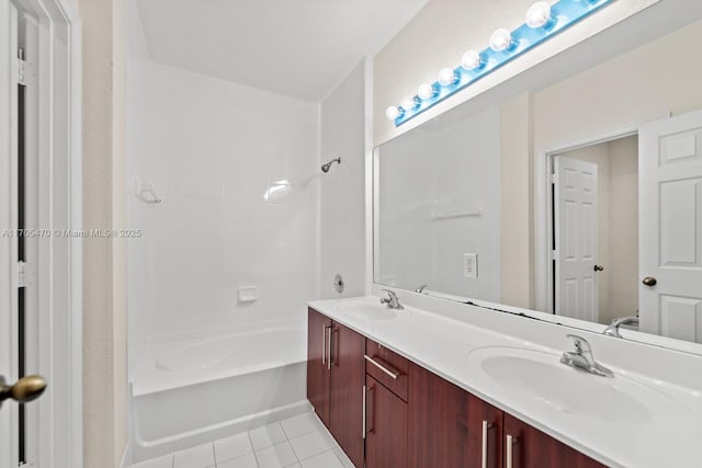 bathroom with tile patterned flooring, vanity, and tub / shower combination