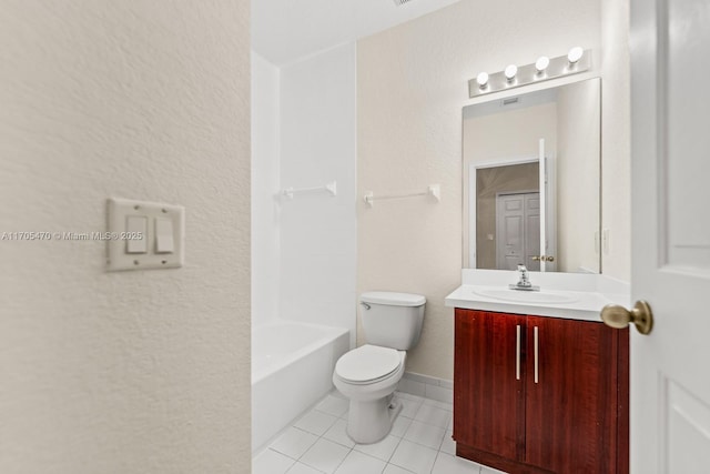 bathroom featuring toilet, vanity, and tile patterned floors