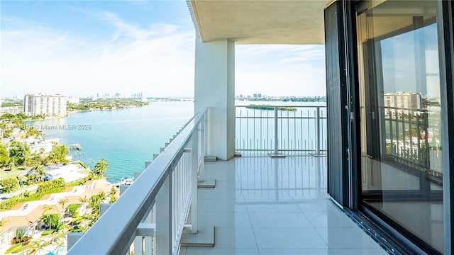 balcony featuring a view of city and a water view