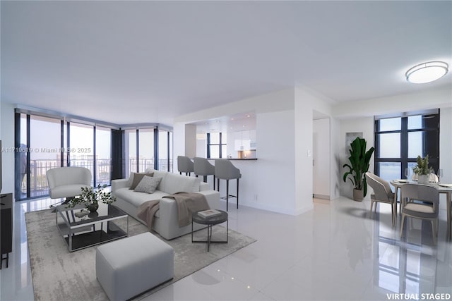 living room featuring expansive windows, baseboards, and a wealth of natural light