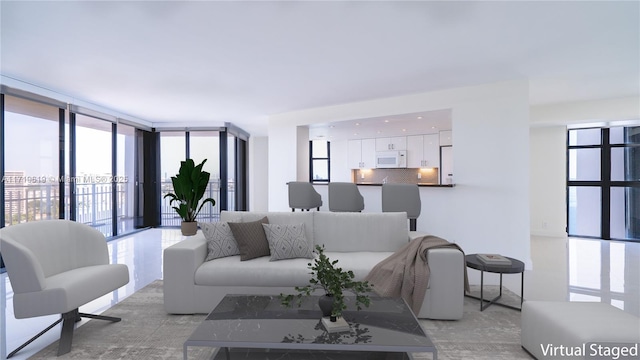 living room with a wall of windows and a wealth of natural light