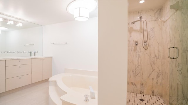 full bath featuring vanity, a marble finish shower, and a bath