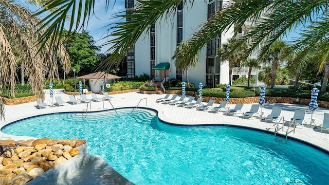 community pool with a patio area