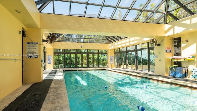 pool featuring a lanai and a patio area