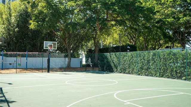 view of basketball court featuring community basketball court and fence