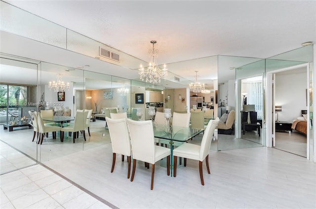 dining area featuring a notable chandelier