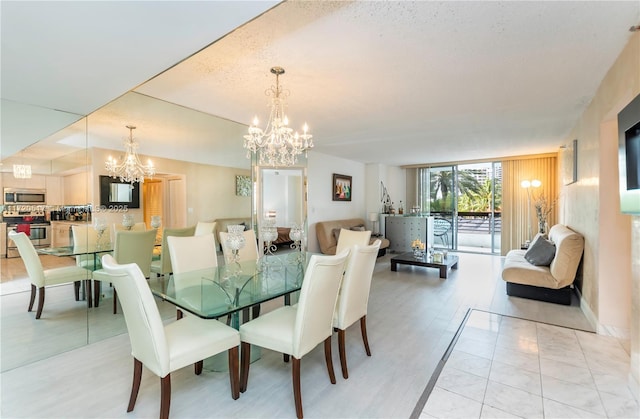 dining room featuring expansive windows and a textured ceiling