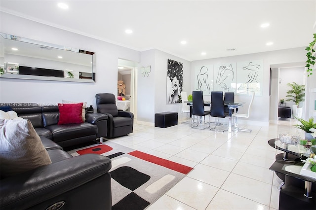 living room featuring ornamental molding and light tile patterned flooring