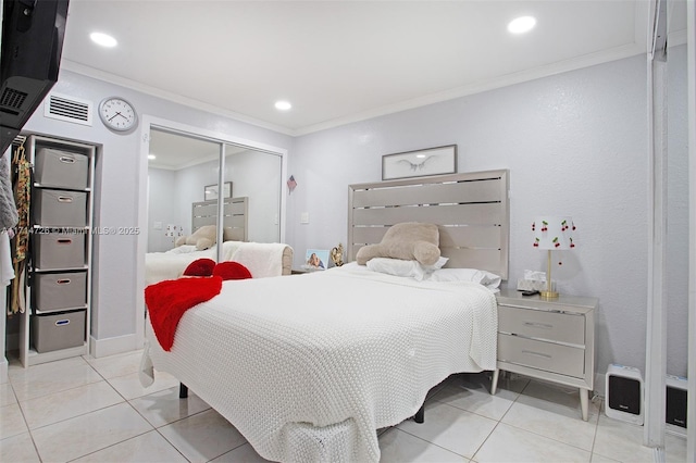 tiled bedroom with a closet and crown molding