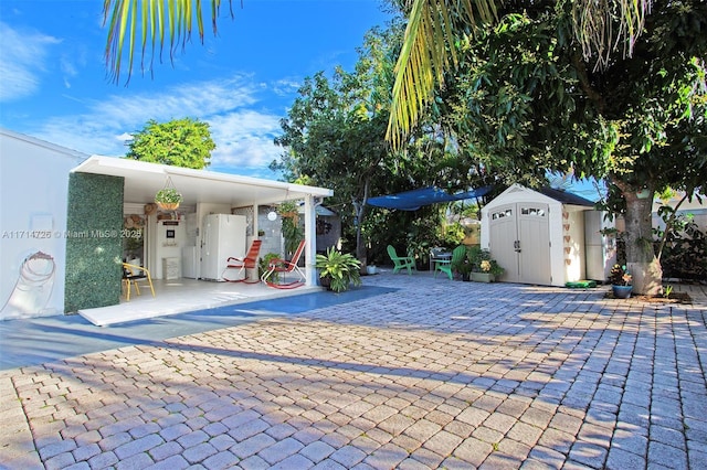 view of patio / terrace with a storage shed