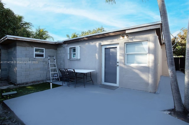 rear view of house featuring a patio