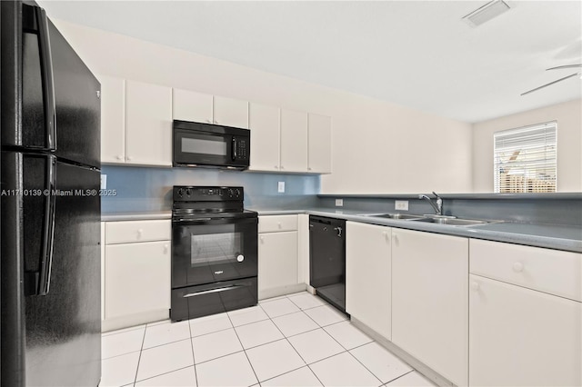 kitchen featuring ceiling fan, sink, black appliances, light tile patterned floors, and white cabinetry