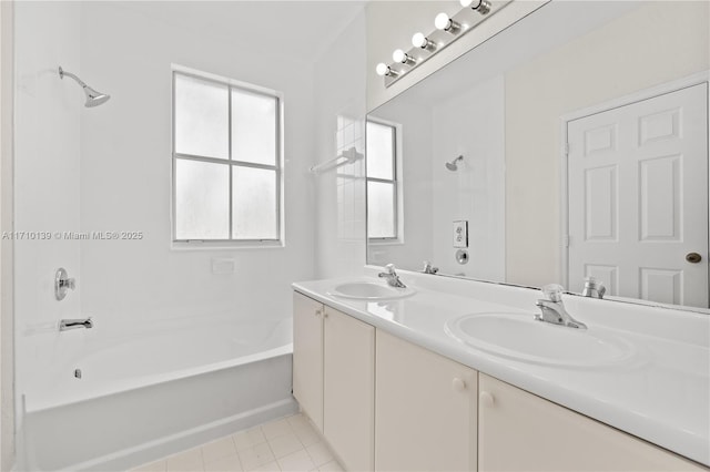 bathroom featuring vanity, bathing tub / shower combination, tile patterned floors, and plenty of natural light