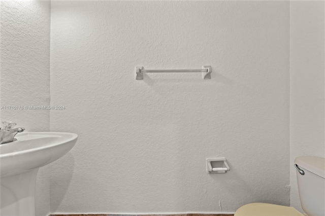 bathroom with toilet and sink