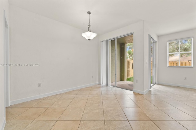 unfurnished room featuring light tile patterned floors