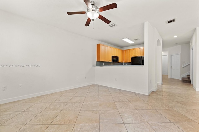 kitchen featuring light brown cabinets, light tile patterned floors, ceiling fan, and black appliances