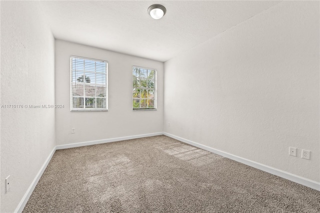 unfurnished room featuring carpet flooring