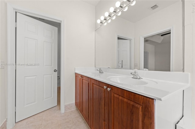 bathroom featuring tile patterned floors and vanity