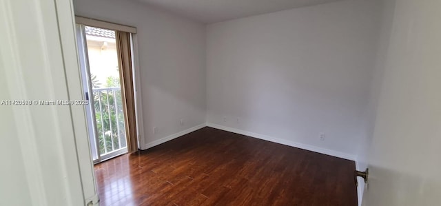 unfurnished room featuring dark hardwood / wood-style floors and a wealth of natural light