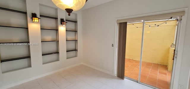 spare room with built in shelves