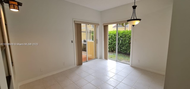 spare room featuring light tile patterned floors