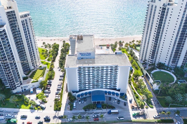 aerial view with a water view and a view of the beach