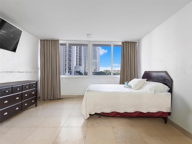 bedroom featuring light tile patterned floors