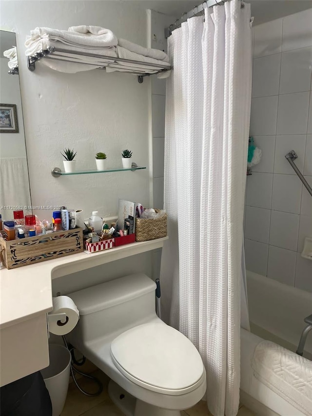 full bathroom featuring vanity, shower / bath combo, and toilet