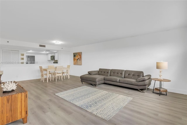 living room with light hardwood / wood-style floors