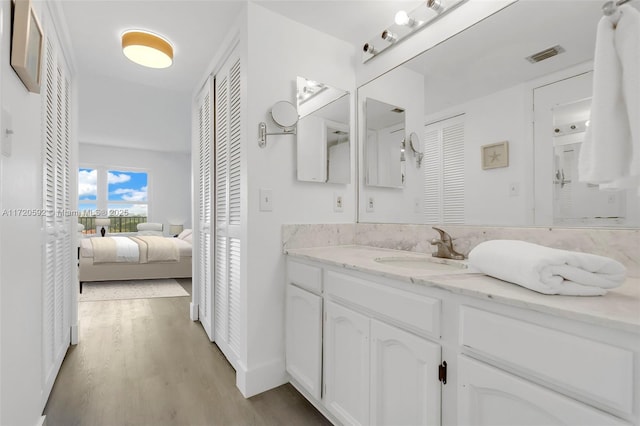 bathroom featuring vanity and hardwood / wood-style flooring