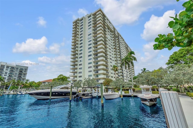 view of pool featuring a boat dock and a water view