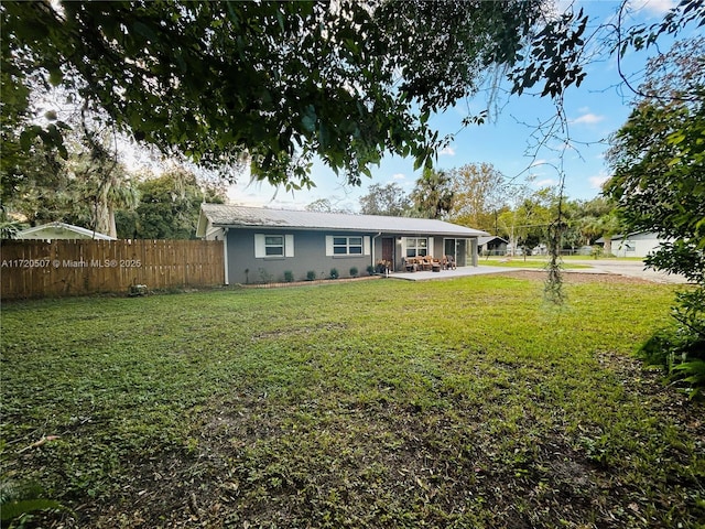 exterior space with a lawn and a patio area