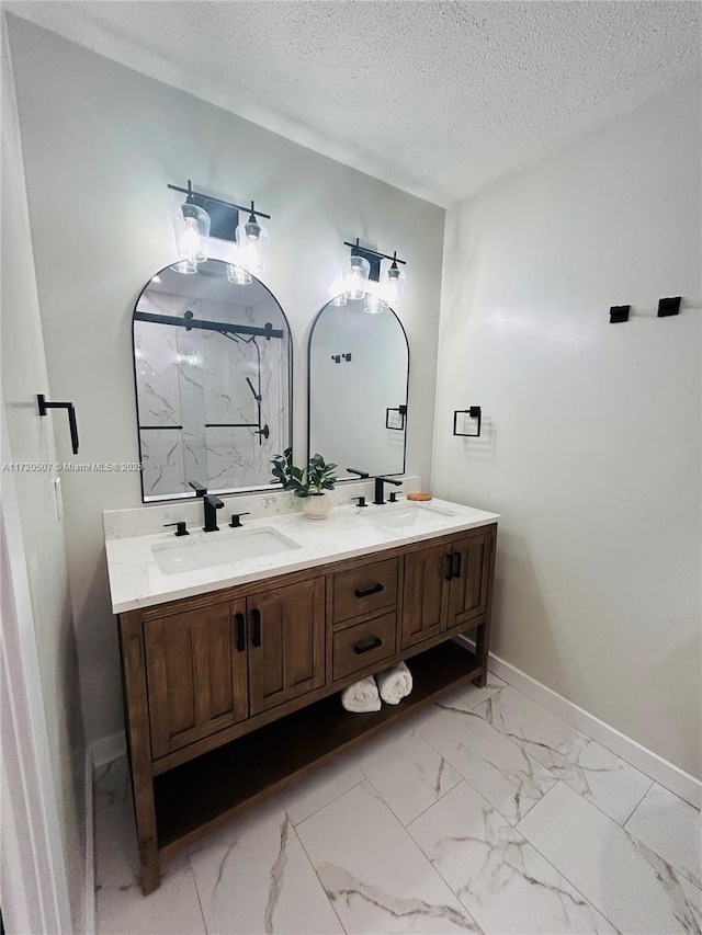 bathroom with vanity and a textured ceiling