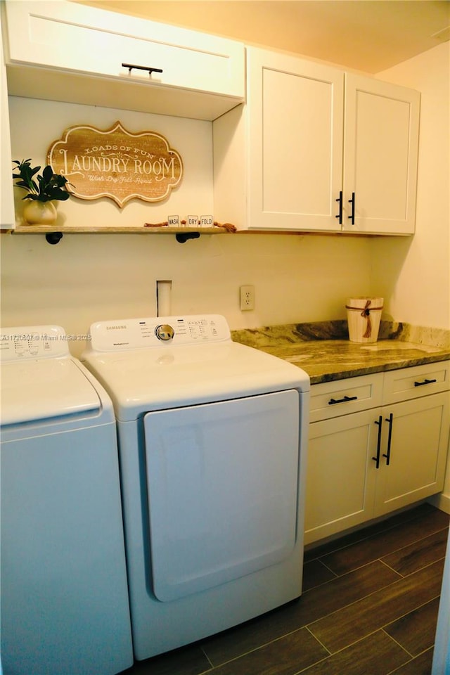 laundry area featuring cabinets and independent washer and dryer