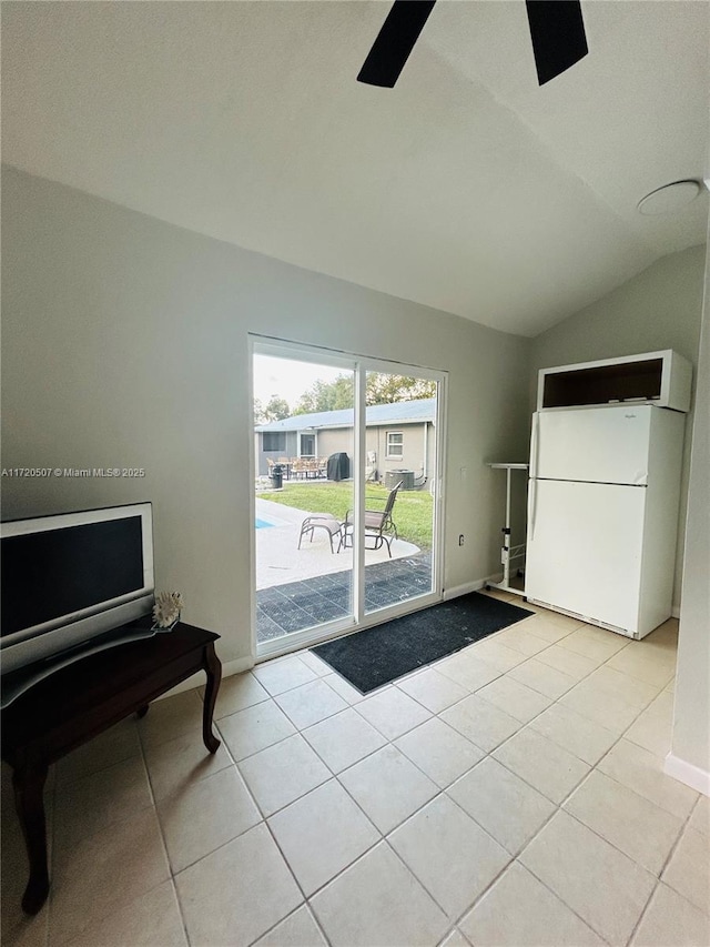 interior space featuring ceiling fan and lofted ceiling