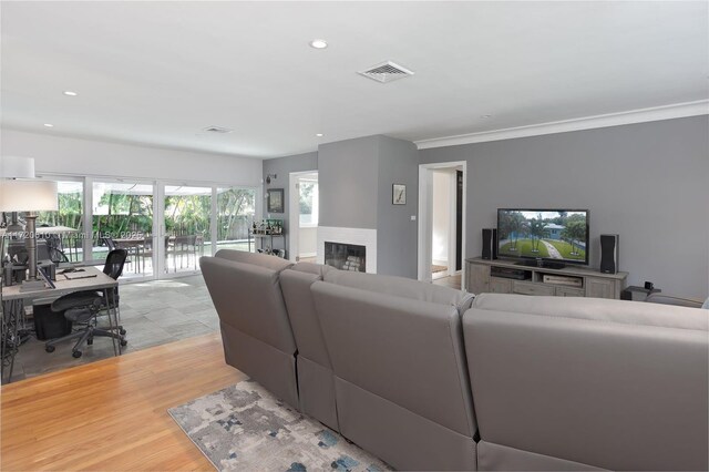 living room with light hardwood / wood-style flooring and french doors