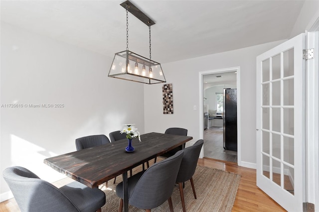 dining space featuring light hardwood / wood-style floors