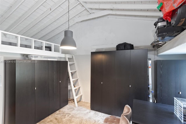 interior space featuring lofted ceiling with beams, wood ceiling, and carpet floors