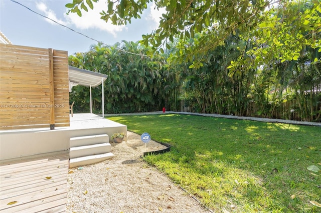 view of yard with a wooden deck