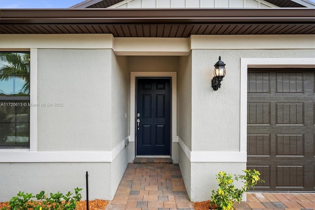 property entrance with a garage