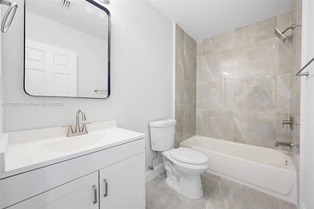 full bathroom with tile patterned floors, vanity, toilet, and tiled shower / bath