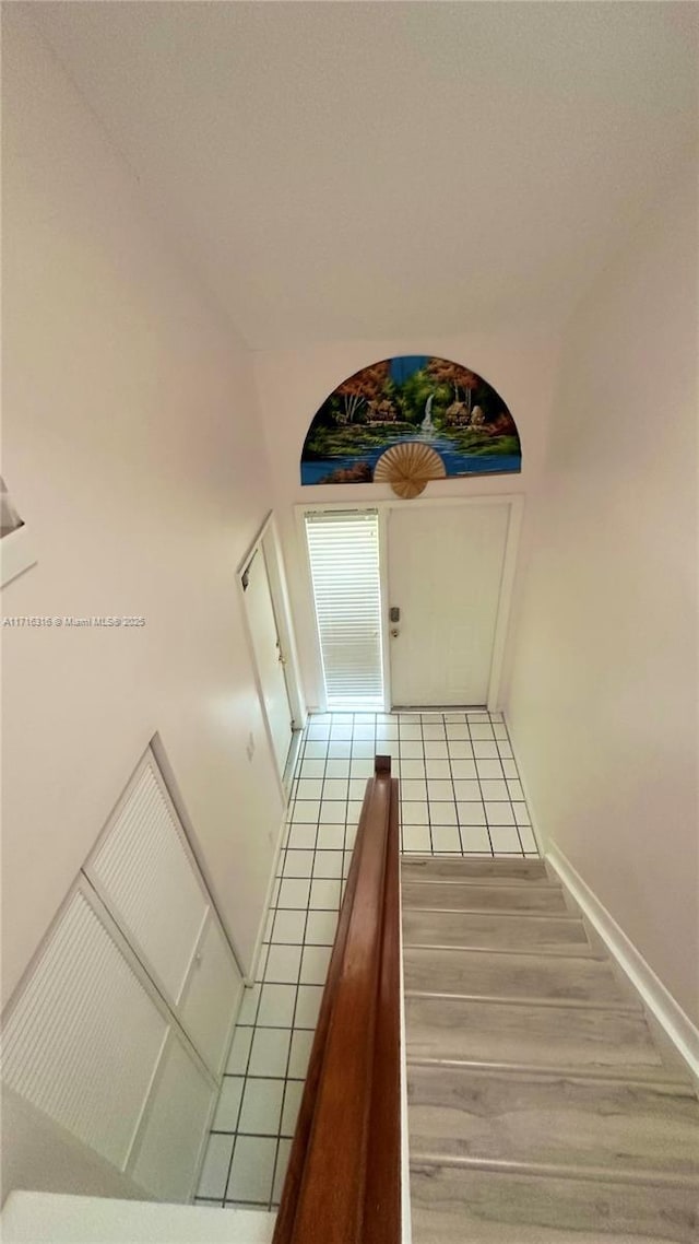 stairs featuring hardwood / wood-style flooring